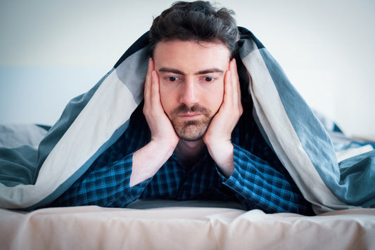 A man thinking what to do if he can't sleep during a sleep study - NSW CPAP